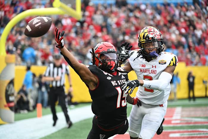 Maryland's Deonte Banks (right) defends